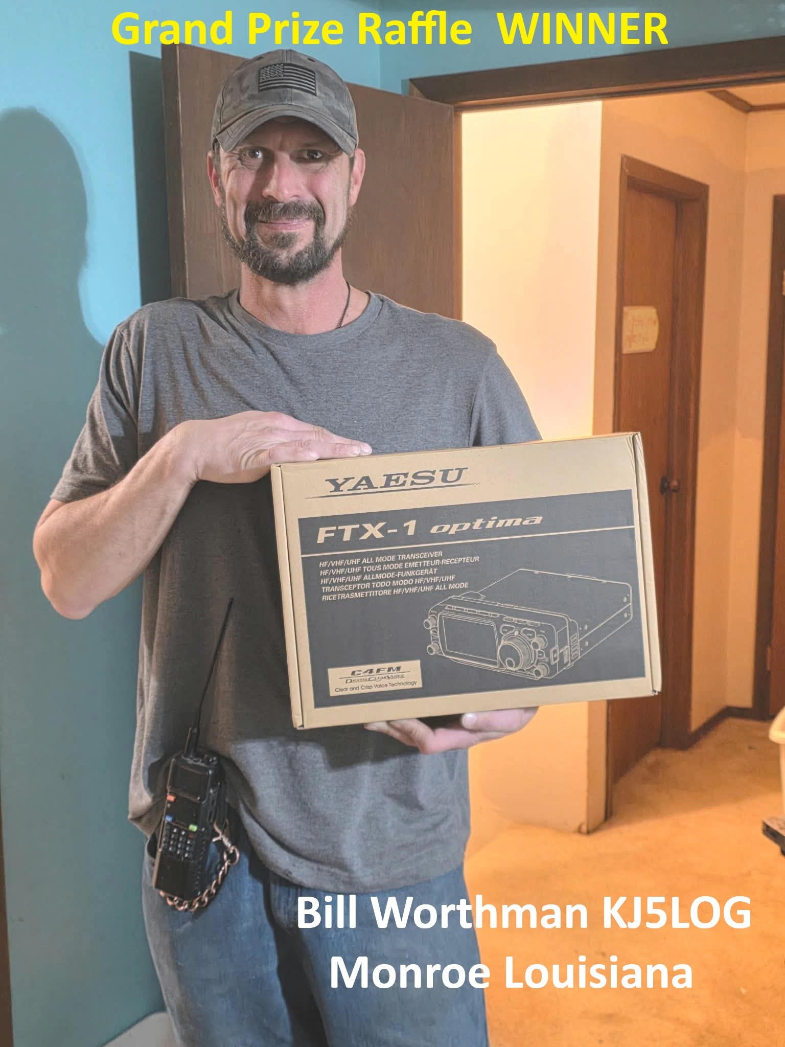 Bill Worthman, KJ5LOG, holding his Yaesu FTX-1 Optima raffle prize box